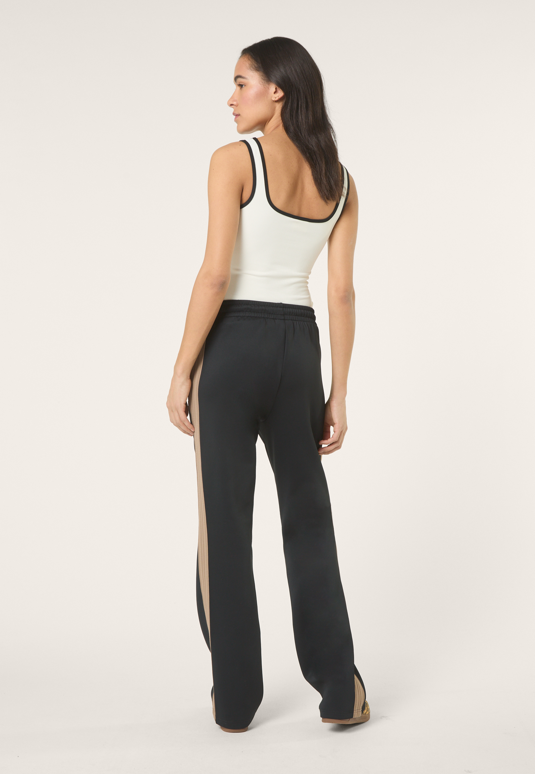 Pantalones deportivos extralargos con franjas - Negro