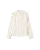 Blusa con vuelo crudo