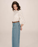 Blusa Stella color crudo con cuello levantado