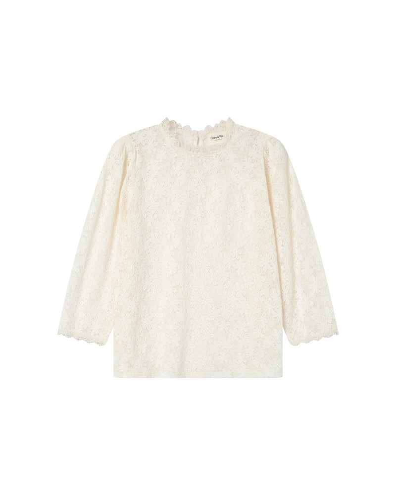 Blusa Stella color crudo con cuello levantado