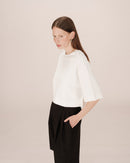 Top corto con estrella marfil