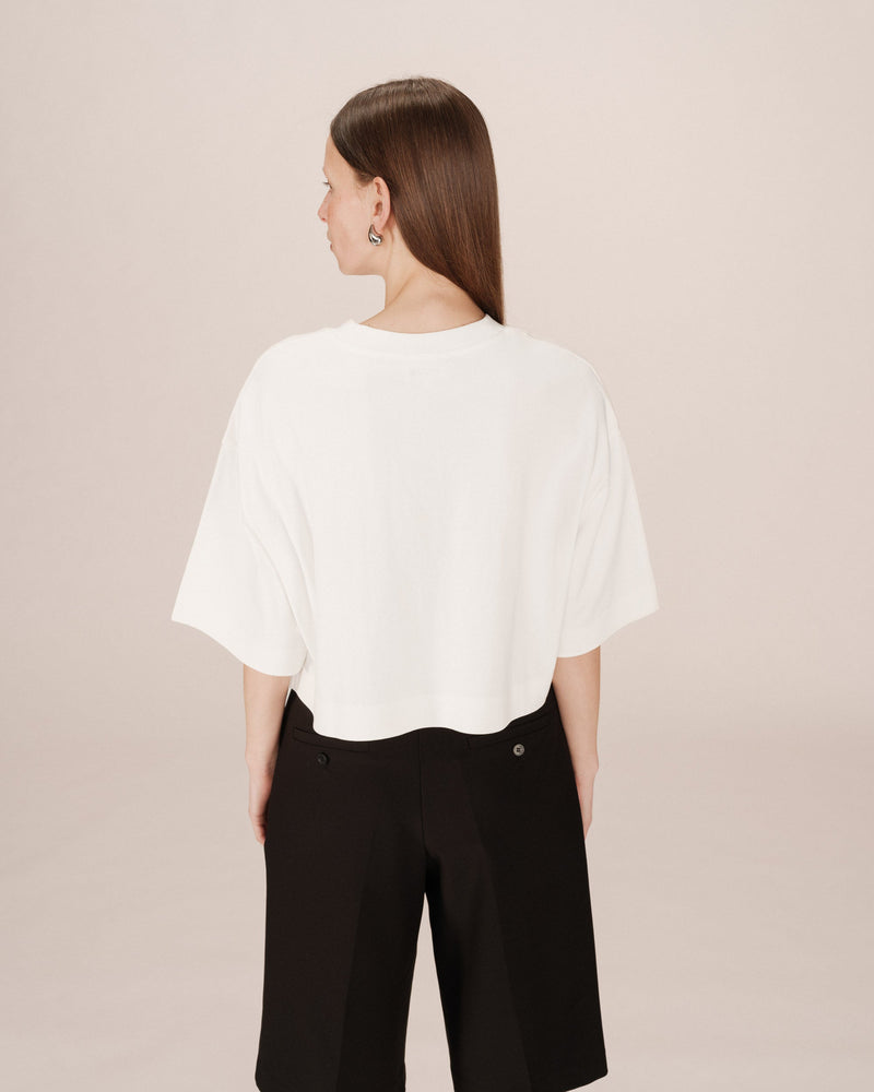 Top corto con estrella marfil