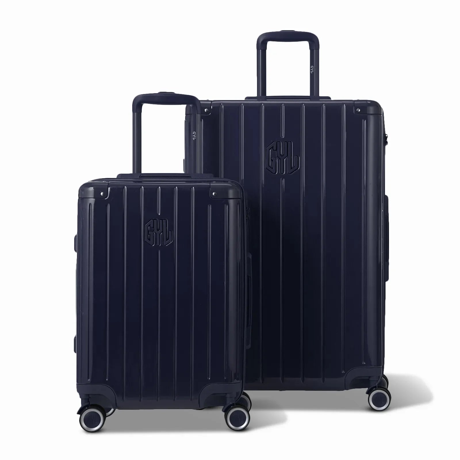 Two GYL Intemporelle navy rigid suitcases, cabin and hold format, with extended trolley handle. #navy_color