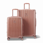 Two GYL Intemporelle rose gold rigid suitcases, cabin and hold format, with extended trolley handle. #color_rose gold