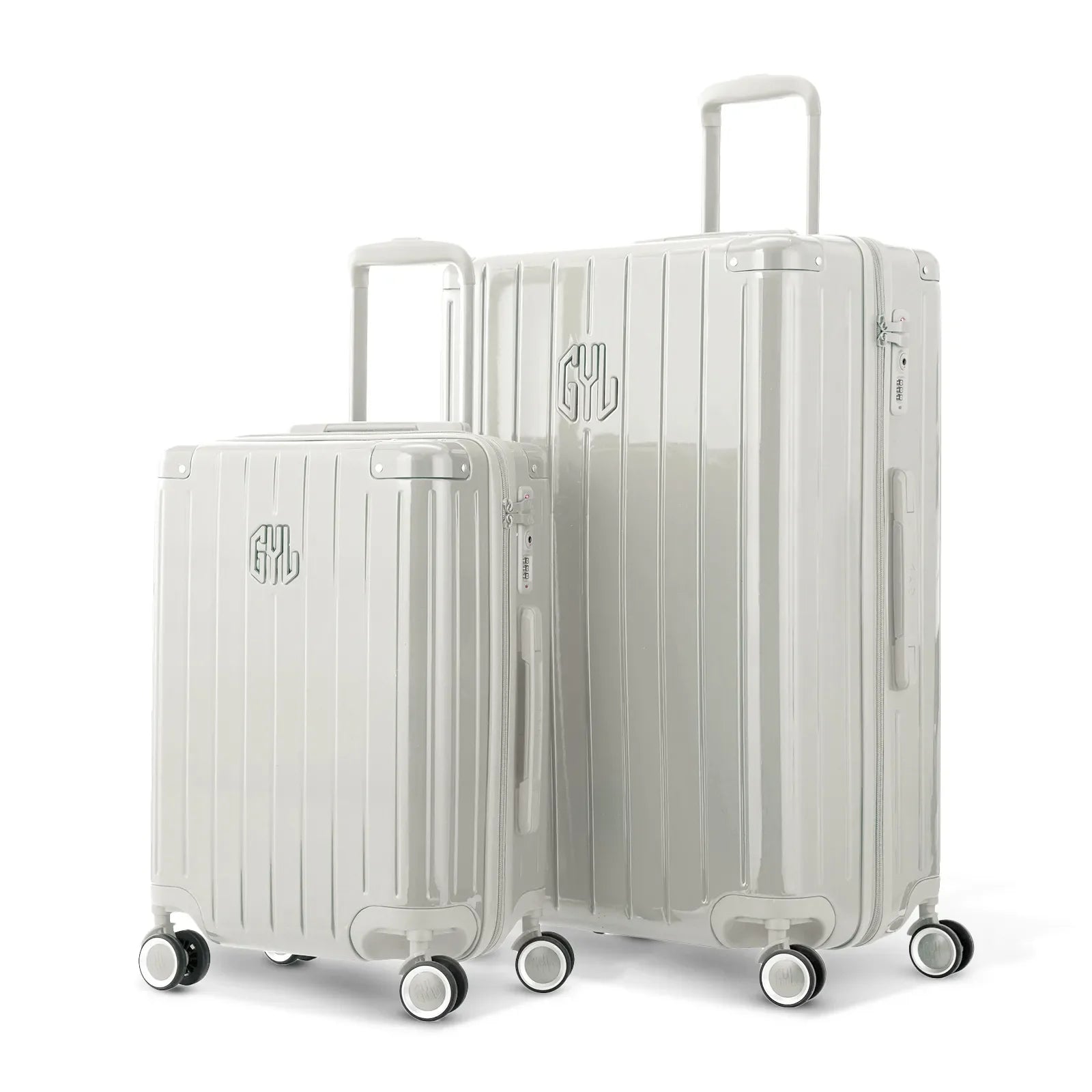 Duo of GYL Intemporelle sand hard suitcases with ribbed shells and telescopic handles. #sand_color