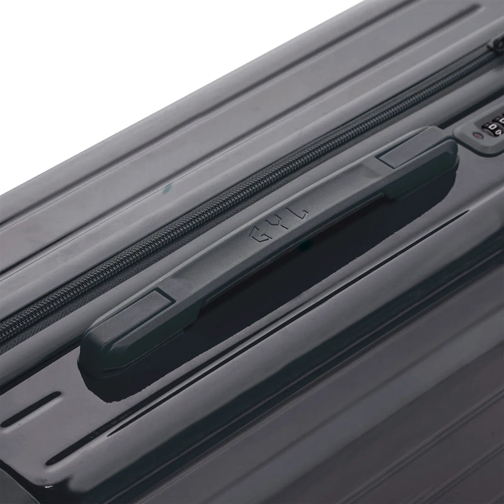 Rigid top handle of the dark gray GYL Intemporelle suitcase with embossed logo on the top. #color_dark gray