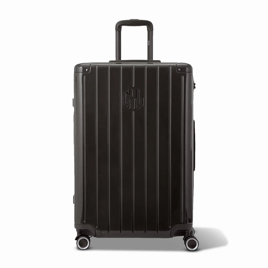 Front view of the GYL Intemporelle black rigid suitcase, embossed logo and 360 degree wheels. #black_color
