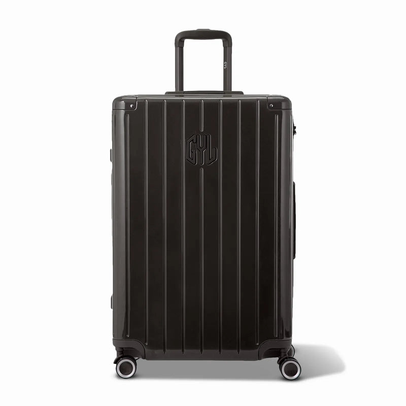 Front view of the GYL Intemporelle black rigid suitcase, embossed logo and 360 degree wheels. #black_color
