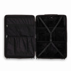 Compartmented interior of the black GYL Intemporelle suitcase with crossed straps and mesh pockets. #black_color