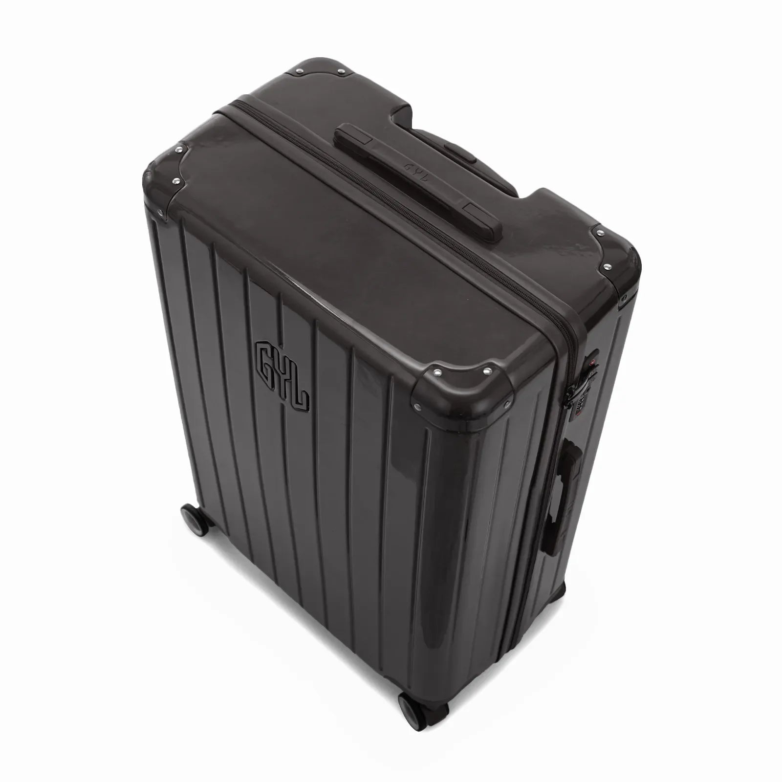 Angled view of the black GYL Intemporelle hardshell suitcase with reinforced corners and shiny ribbed shell. #black_color