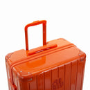GYL telescopic trolley handle deployed on the Intemporelle orange polycarbonate suitcase. #dark_orange_color