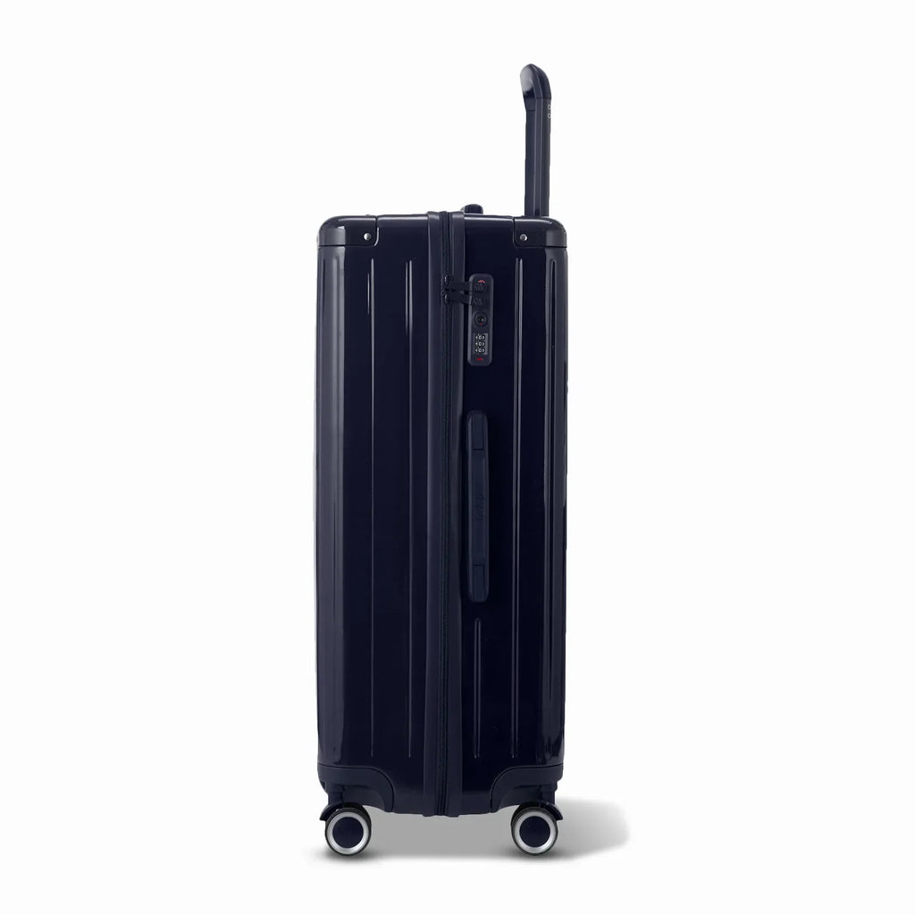 Side view of the GYL Intemporelle navy hard suitcase with telescopic handle and TSA closure. #navy_color
