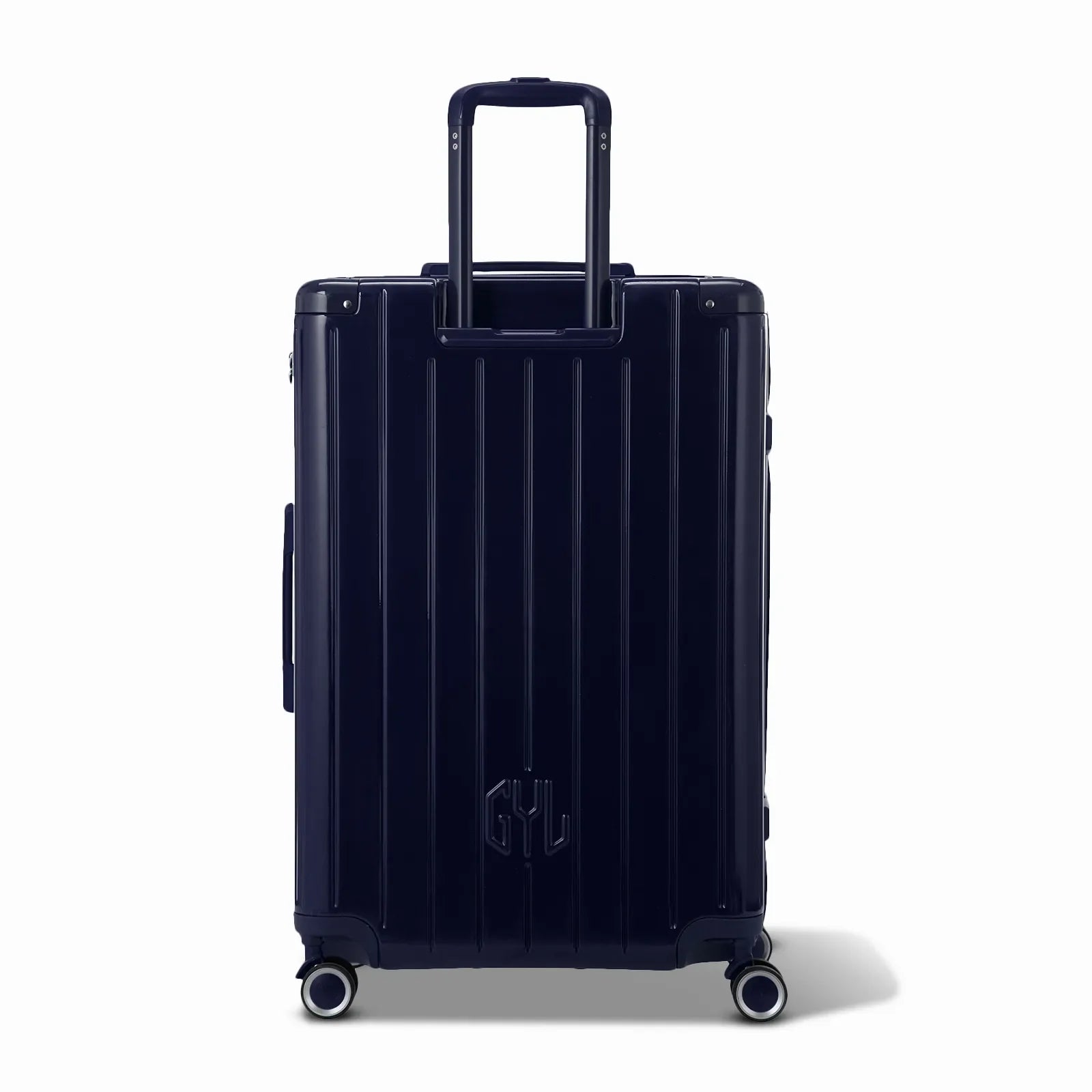 Rear view of the GYL Intemporelle navy hard suitcase with integrated handles and swivel casters. #navy_color