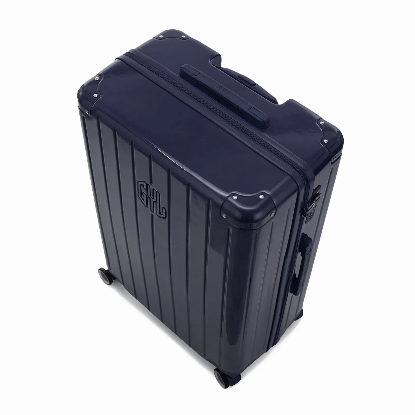 Angled view of the GYL Intemporelle navy hardshell suitcase with reinforced corners and shiny ribbed shell. #navy_color