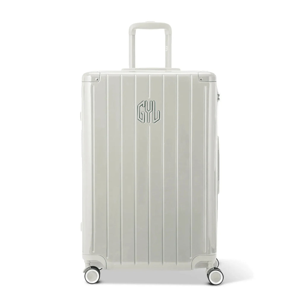 Front view of the GYL Intemporelle sand hard suitcase, embossed logo and 360 degree wheels. #sand_color