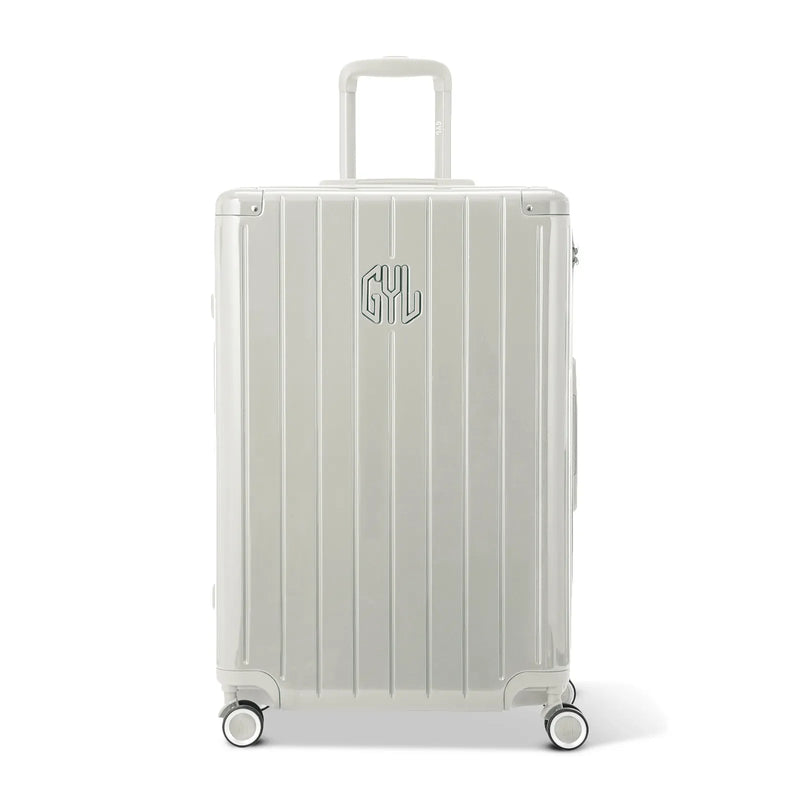 Front view of the GYL Intemporelle sand hard suitcase, embossed logo and 360 degree wheels. #sand_color