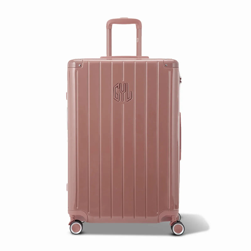Front view of the GYL Intemporelle rose gold rigid suitcase, embossed logo and 360 degree wheels. #color_rose gold