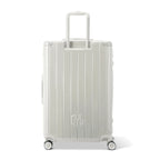 Rear view of the GYL Intemporelle sand hard suitcase with integrated handles and swivel casters. #sand_color