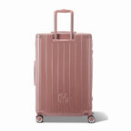 Rear view of the GYL Intemporelle rose gold rigid suitcase with integrated handles and swivel wheels. #color_rose gold