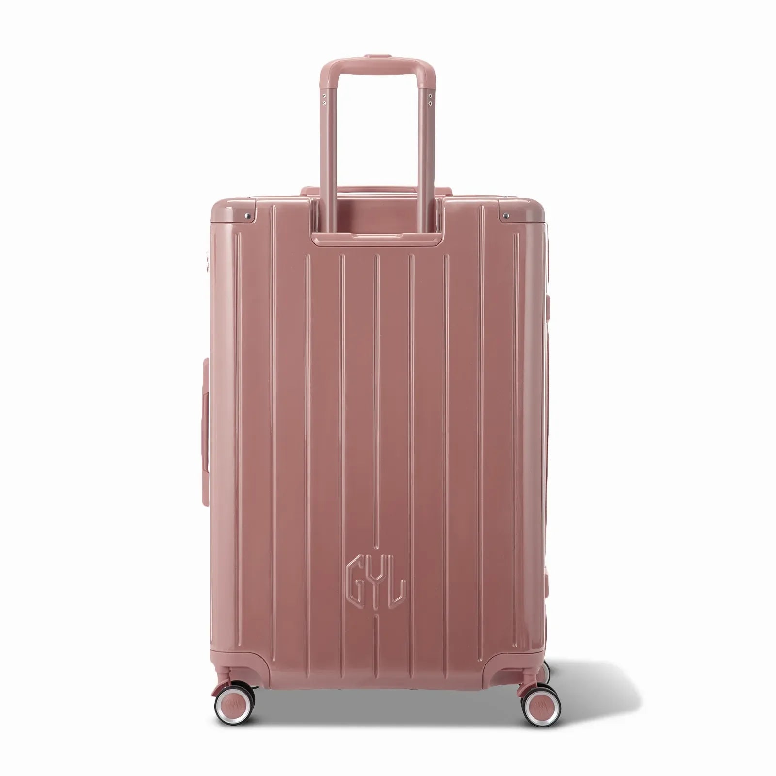 Rear view of the GYL Intemporelle rose gold rigid suitcase with integrated handles and swivel wheels. #color_rose gold