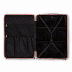 Compartmented interior of the GYL Intemporelle rose gold suitcase with crossed straps and mesh pockets. #color_rose gold