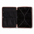 Compartmented interior of the GYL Intemporelle rose gold suitcase with crossed straps and mesh pockets. #color_rose gold