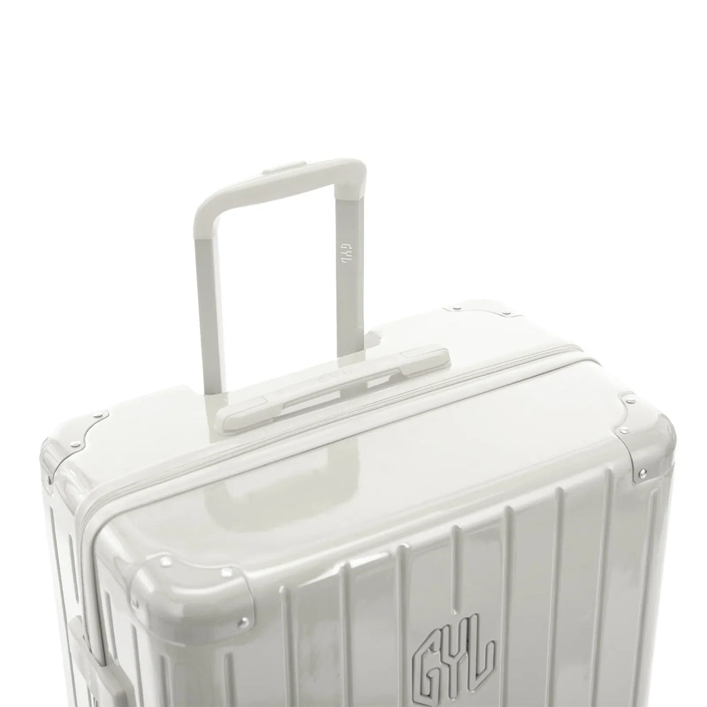 GYL telescopic trolley handle deployed on the Intemporelle sand polycarbonate suitcase. #sand_color