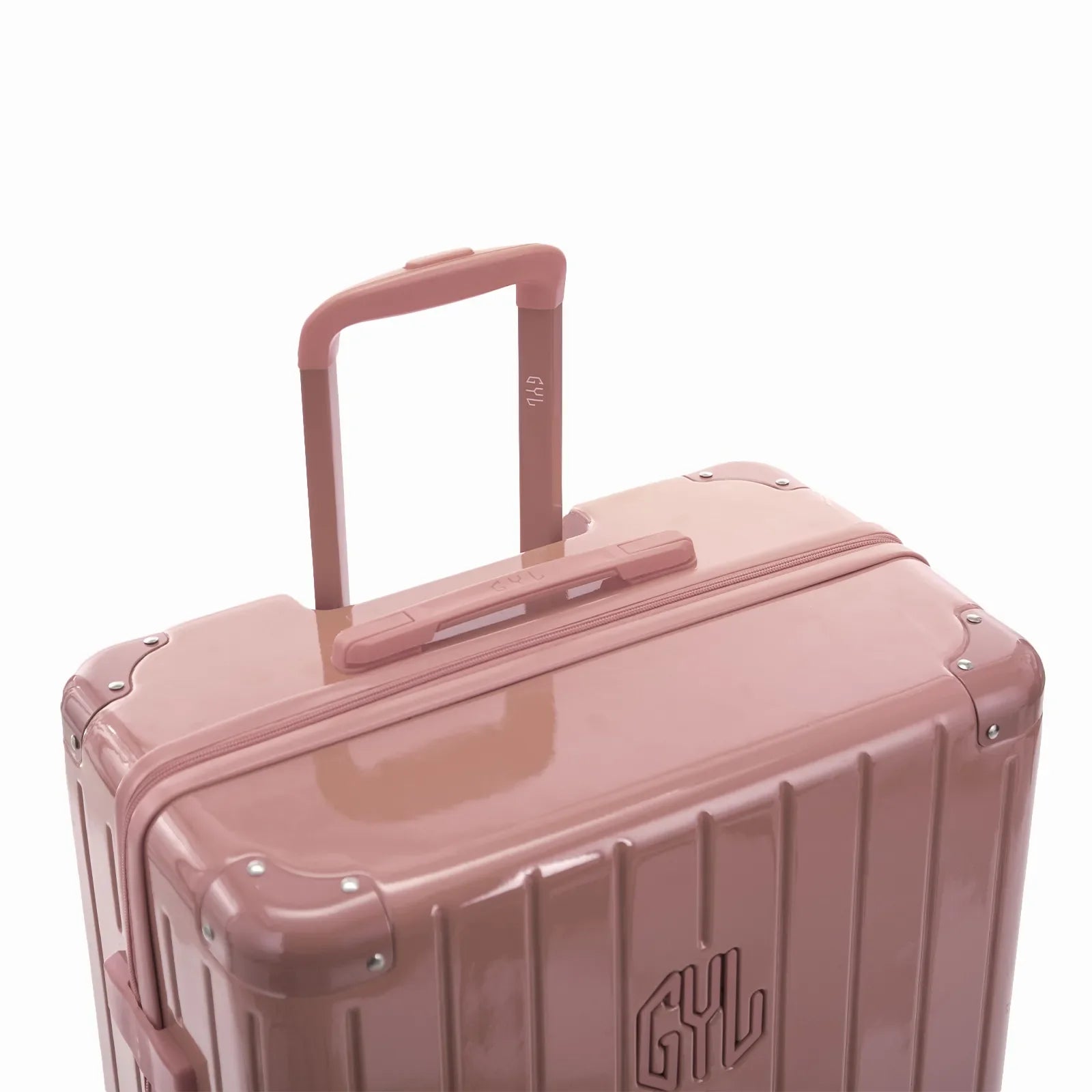 GYL telescopic trolley handle deployed on the Intemporelle rose gold polycarbonate suitcase. #color_rose gold