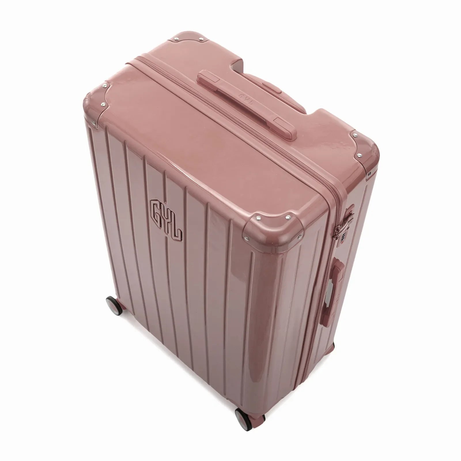 Angled view of the GYL Intemporelle rose gold hard suitcase with reinforced corners and shiny ribbed shell. #color_rose gold