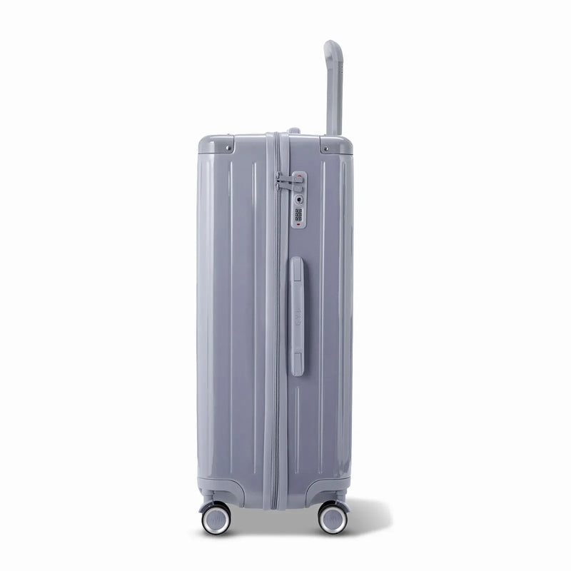 Side view of the GYL Intemporelle silver hard suitcase with telescopic handle and TSA closure. #silver_color
