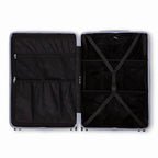Compartmented interior of the silver GYL Intemporelle suitcase with crossed straps and mesh pockets. #silver_color