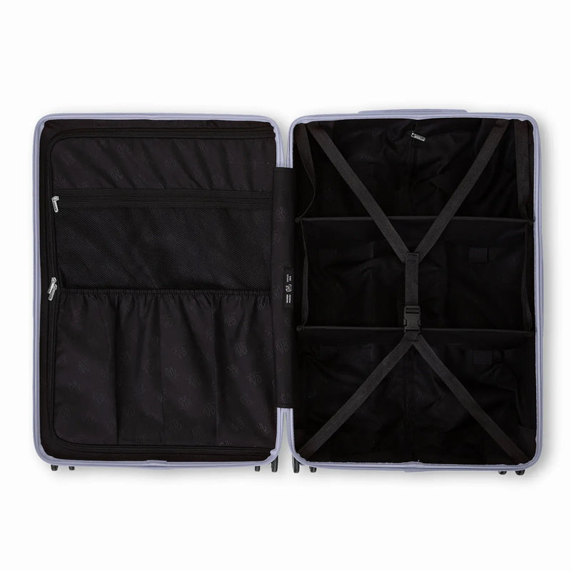 Compartmented interior of the silver GYL Intemporelle suitcase with crossed straps and mesh pockets. #silver_color
