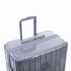 GYL telescopic trolley handle deployed on the Intemporelle silver polycarbonate suitcase. #silver_color