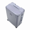 Angled view of the silver GYL Intemporelle hardshell suitcase with reinforced corners and shiny ribbed shell. #silver_color