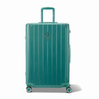 Front view of the water green GYL Intemporelle hard suitcase, embossed logo and 360 degree wheels. #color_green