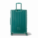 Rear view of the water green GYL Intemporelle rigid suitcase with integrated handles and swivel casters. #color_green