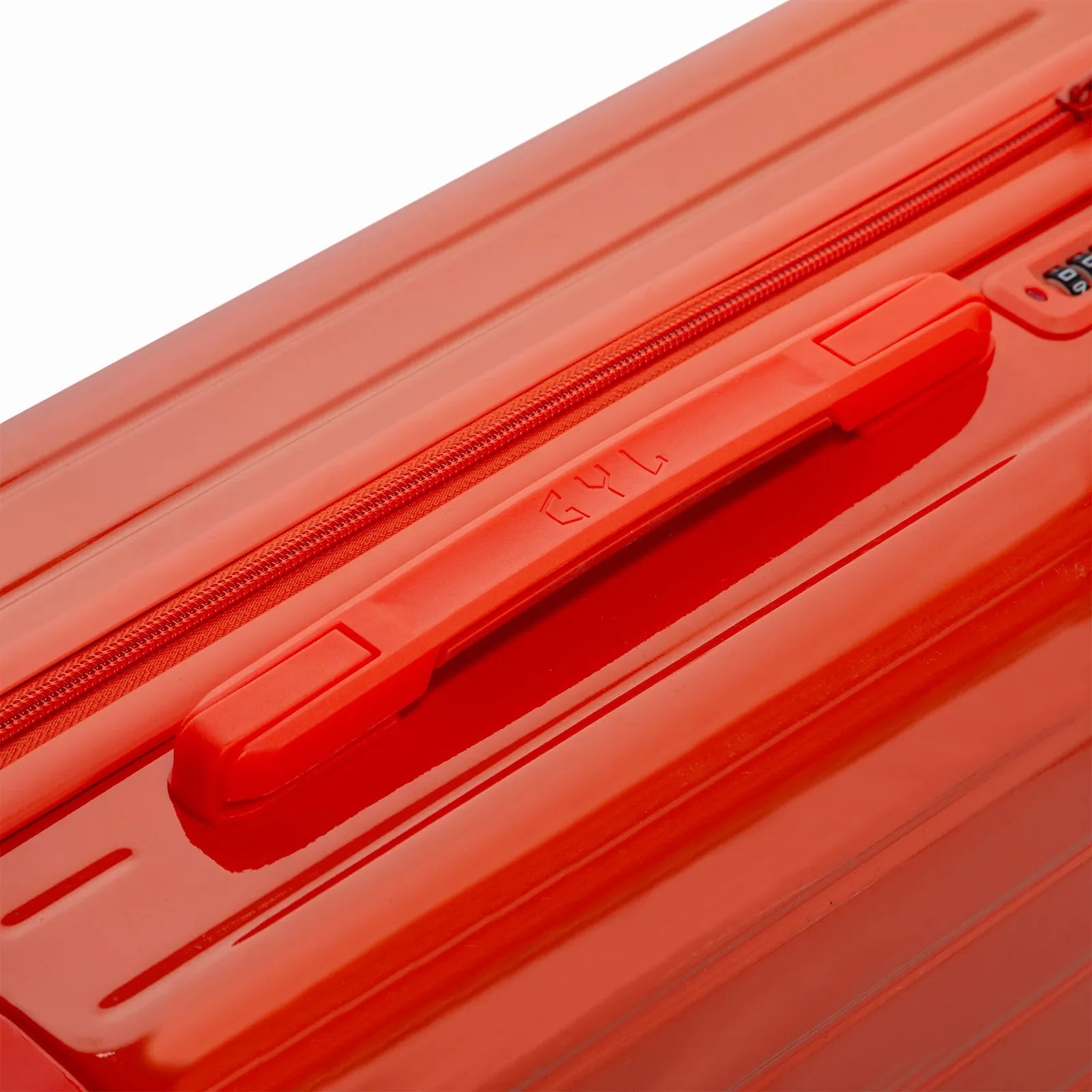 Rigid top handle of the orange GYL Intemporelle suitcase with embossed logo on the top. #dark_orange_color