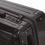 TSA combination closure and GYL double zip slider on the Intemporelle black rigid suitcase. #black_color