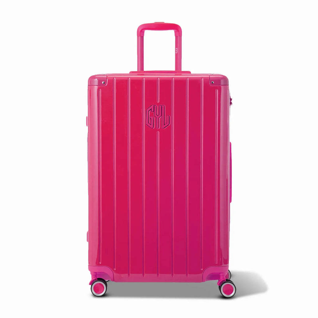 Front view of the GYL Intemporelle fuchsia hard suitcase, embossed logo and 360 degree wheels. #color_fuchsia