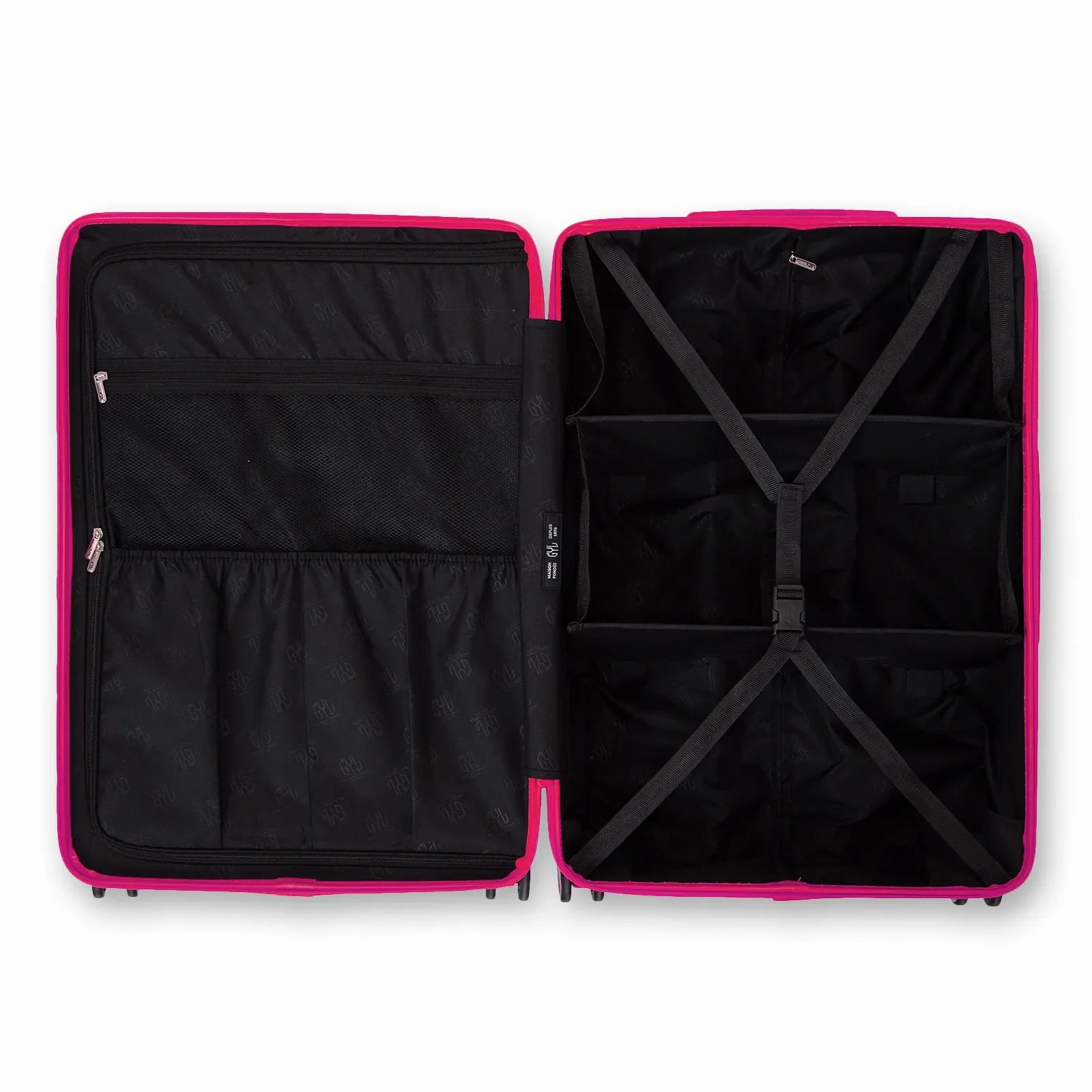Compartmented interior of the GYL Intemporelle fuchsia suitcase with crossed straps and mesh pockets. #color_fuchsia