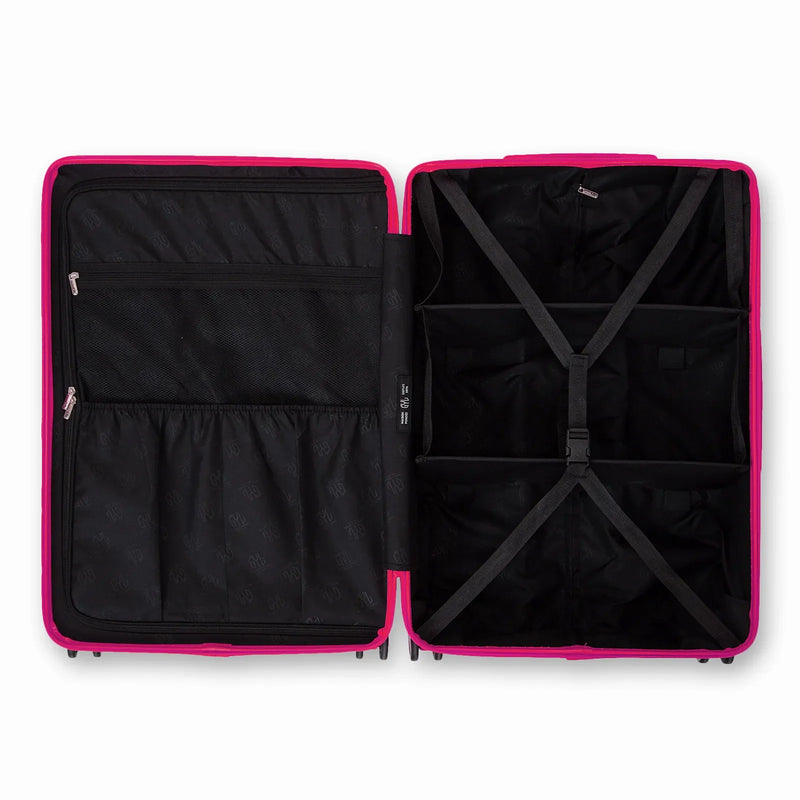 Compartmented interior of the GYL Intemporelle fuchsia suitcase with crossed straps and mesh pockets. #color_fuchsia