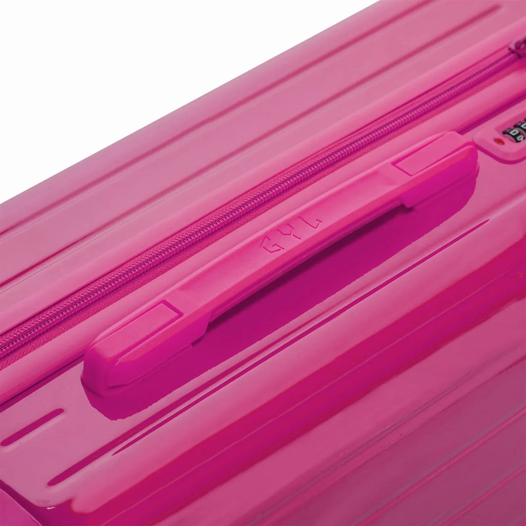 Rigid top handle of the fuchsia GYL Intemporelle suitcase with embossed logo on the top. #color_fuchsia