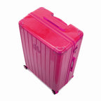 Angled view of the GYL Intemporelle fuchsia hard suitcase with reinforced corners and shiny ribbed shell. #color_fuchsia