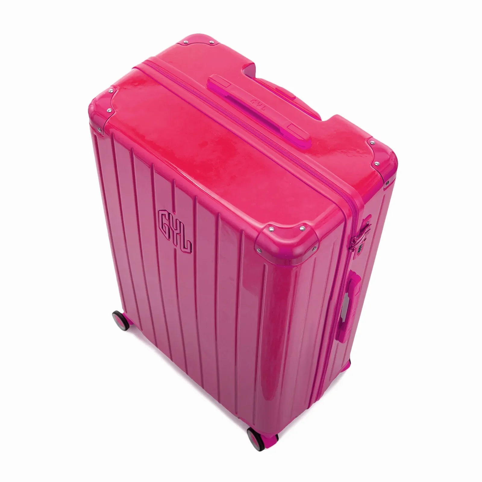 Angled view of the GYL Intemporelle fuchsia hard suitcase with reinforced corners and shiny ribbed shell. #color_fuchsia