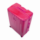 Angled view of the GYL Intemporelle fuchsia hard suitcase with reinforced corners and shiny ribbed shell. #color_fuchsia