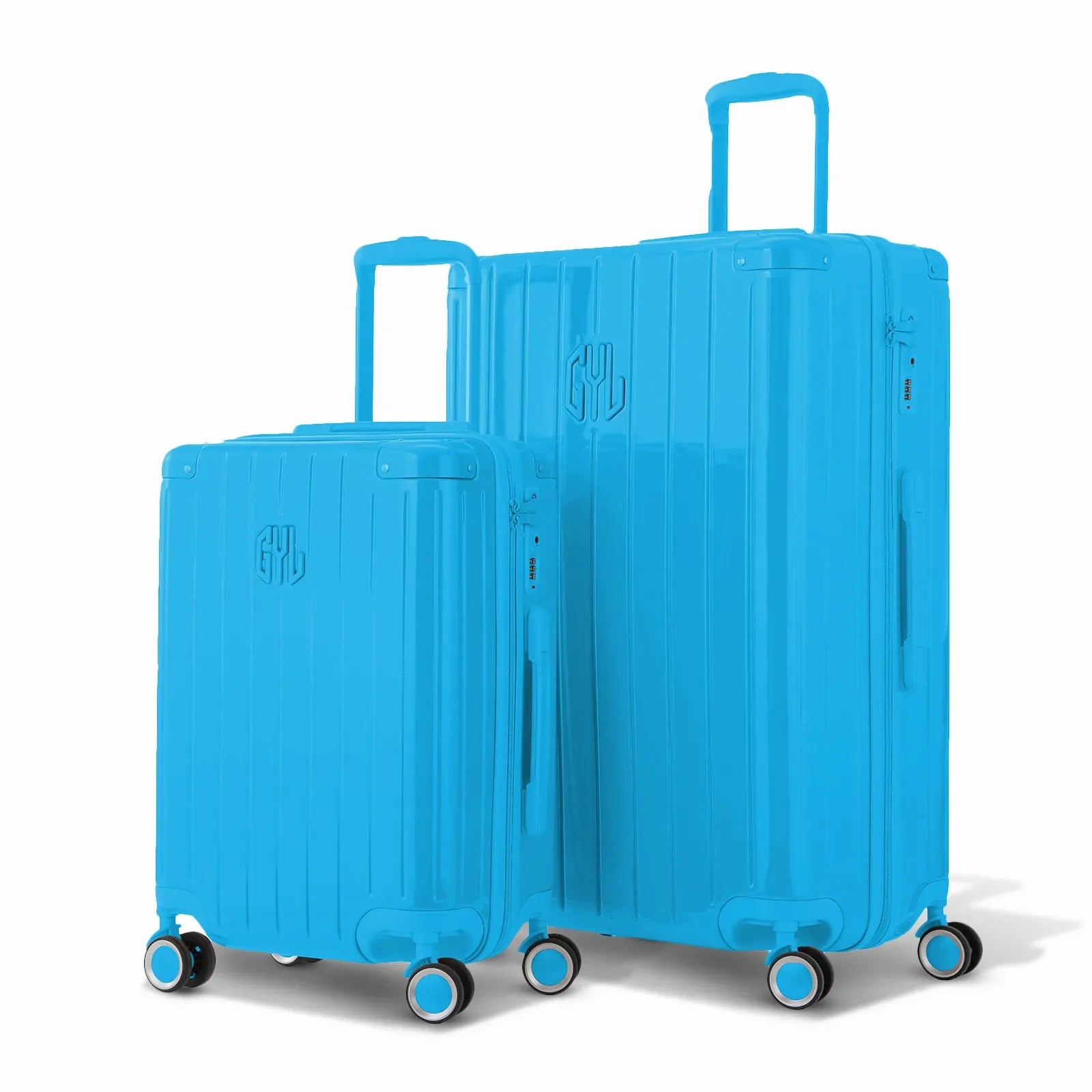 Duo of GYL Intemporelle rigid suitcases in mint with ribbed shells and telescopic handles. #mint_color