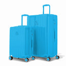 Duo of GYL Intemporelle rigid suitcases in mint with ribbed shells and telescopic handles. #mint_color