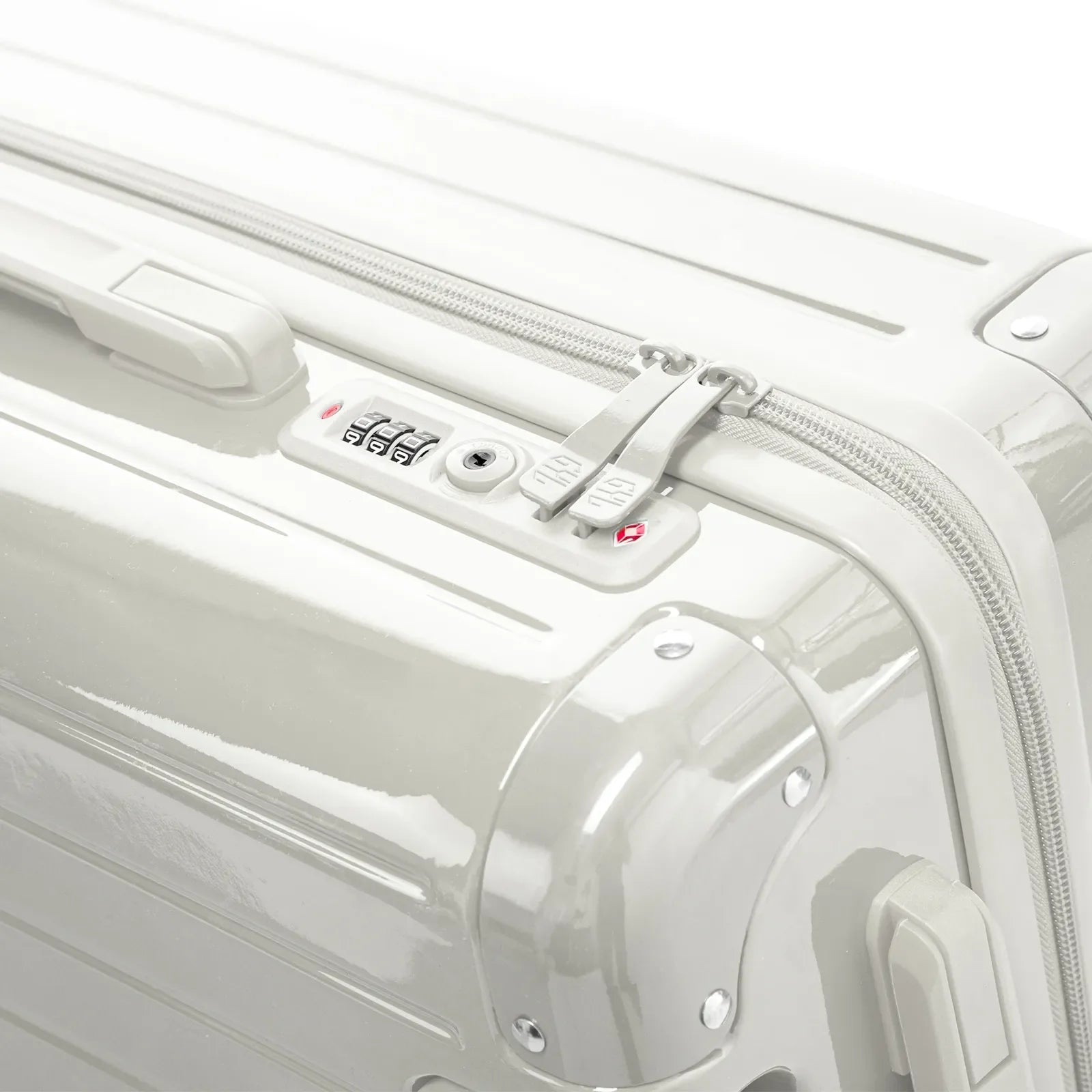 TSA combination closure and GYL double slider zipper on the Intemporelle sand hard suitcase. #sand_color