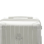 Rigid top handle of the GYL Intemporelle sand suitcase with embossed logo on the top. #sand_color