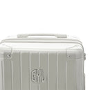 Rigid top handle of the GYL Intemporelle sand suitcase with embossed logo on the top. #sand_color
